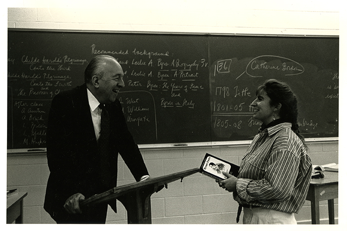 Edwin Graves Wilson conversing with woman student