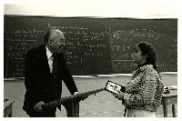 Generated thumbnail: Edwin Graves Wilson conversing with woman student