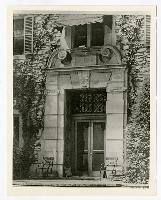 Generated thumbnail: Ivy-covered entrance of Graylyn Estate mansion with chairs