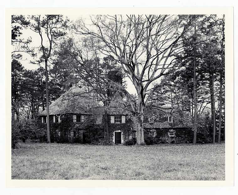 Building with ivy and large trees
