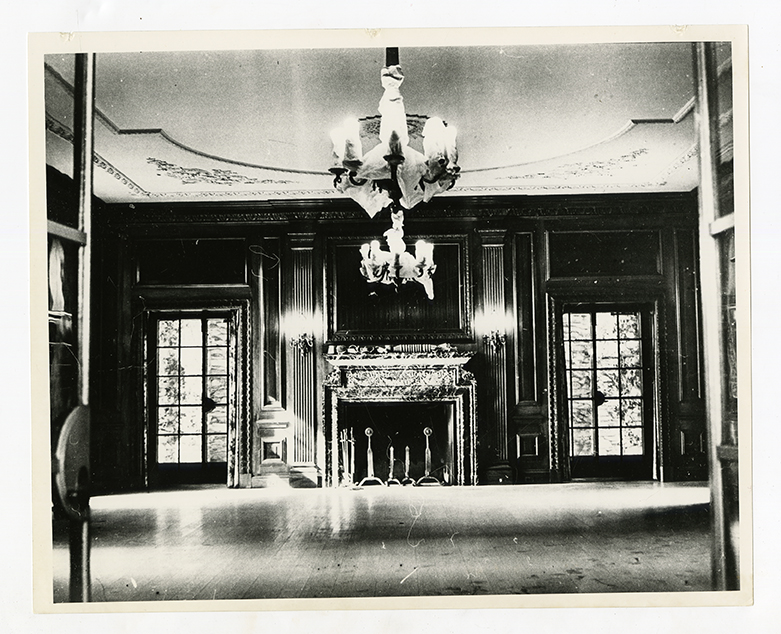Grand ballroom with ornate fireplace and chandelier in Graylyn Estate mansion
