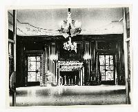 Generated thumbnail: Grand ballroom with ornate fireplace and chandelier in Graylyn Estate mansion