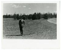 Generated thumbnail: Bowman Gray, Jr. walking in a field circa 1940