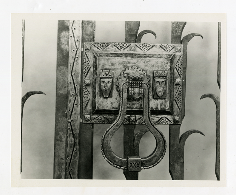 Ornate metal gate with decorative lock