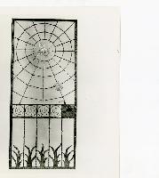 Generated thumbnail: Ornamental iron gate with spider web design