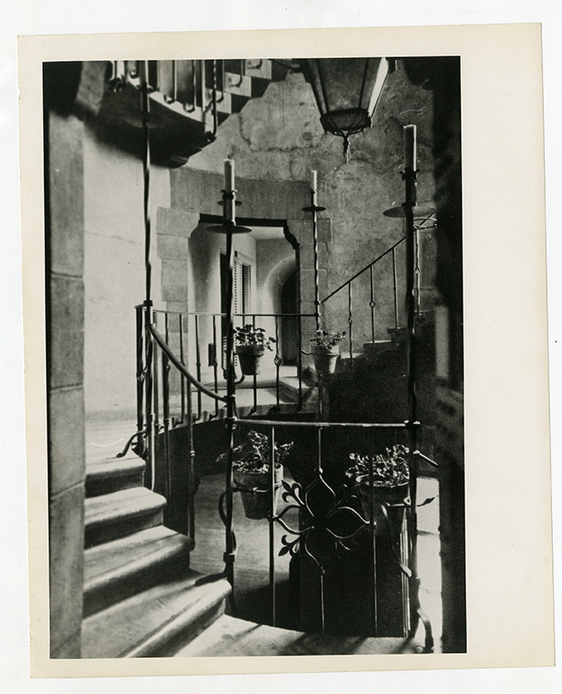 Interior staircase with ornate ironwork