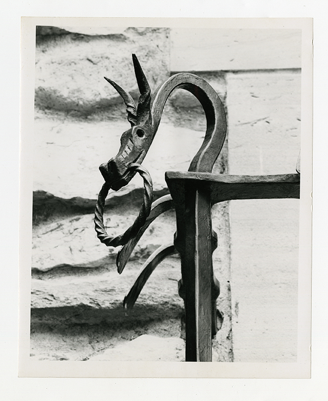 Close-up of dragon ironwork detail from exterior balcony