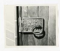 Generated thumbnail: Close-up of decorative door latch with mermaid motif