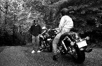 Generated thumbnail: Wet Motorcycle Couple