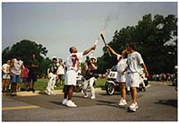Generated thumbnail: Atlanta Olympics torch relay in front of library