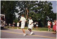 Generated thumbnail: Atlanta Olympics torch relay in front of library