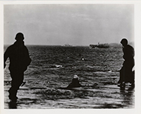 Generated thumbnail: Three crewman on approaching ship view 4th USS Princeton (CLV-23) on fire east of Luzon as another ship appoaches.