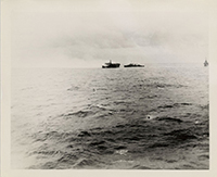 Generated thumbnail: View of 4th USS Princeton (CLV-23) on fire east of Luzon on October 24, 1944 with another ship aproaching to assist.