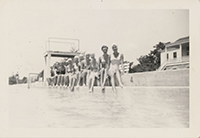 Generated thumbnail: Twelve women sit on the edge of the Wake Forest Community Center pool.
