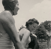 Generated thumbnail: Four women in bathing suits at a swim event for the Women's Health Club