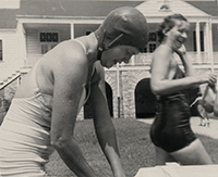 Generated thumbnail: Two women in bathing suits at a swim event for the Women's Health Club