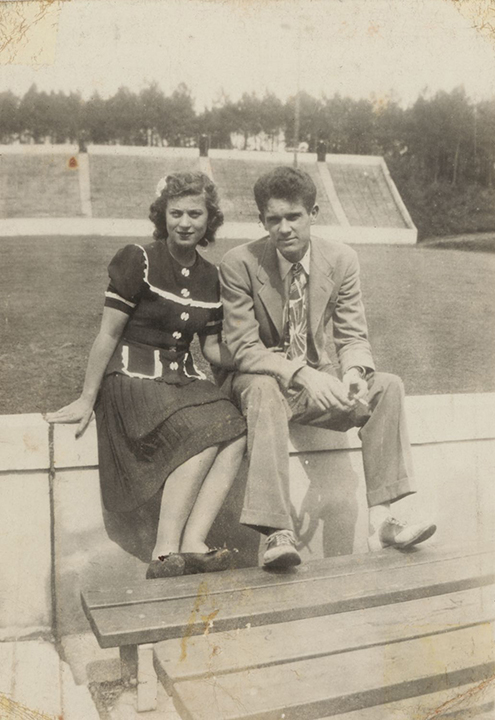 Edward M Stanfield with a young woman at Groves stadium