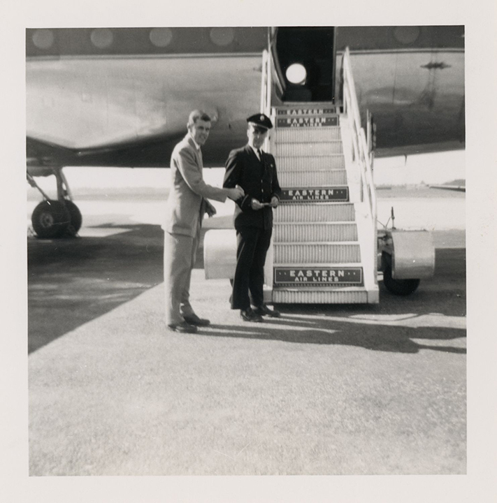 Tunney Brooks presents his ticket before boarding an airplane