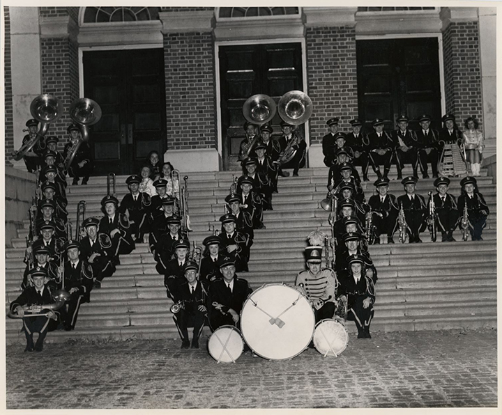 Wake Forest College Marching Band with drum majors and majorettes form "WF" on the steps of Gore Gymnasium