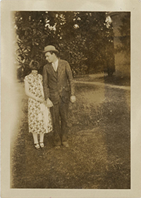 Generated thumbnail: Man and woman standing in front of magnolia trees