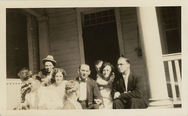 Family snapshot on porch of Powers-Arrington house including Hallie and Thomas (II and II) Arrington
