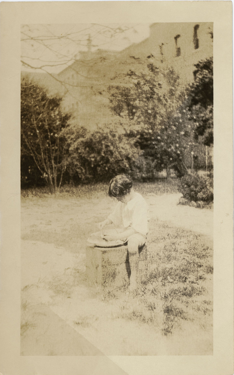 Child playing in a yard