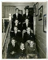 Generated thumbnail: Boys and young men on stairs at "Gaga house"